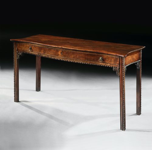 George III Mahogany Serpentine Side Table in the Manner of Wright & Elwick.

