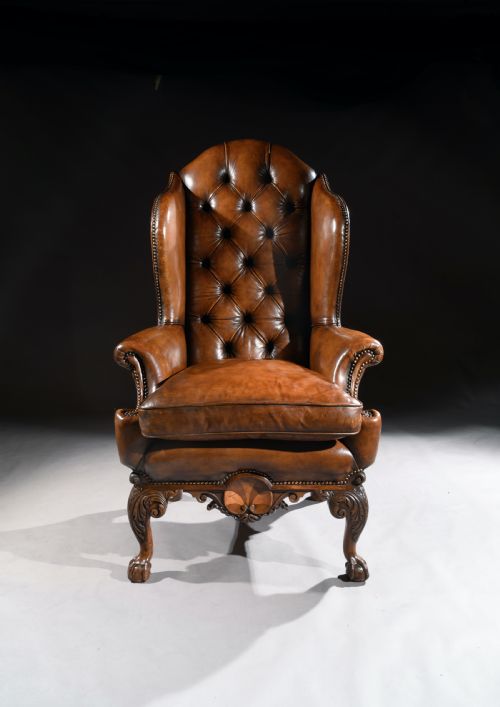 Late 19th Century George II Style Walnut Leather Upholstered Wing Back Armchair of Superb Shape and Proportions.
