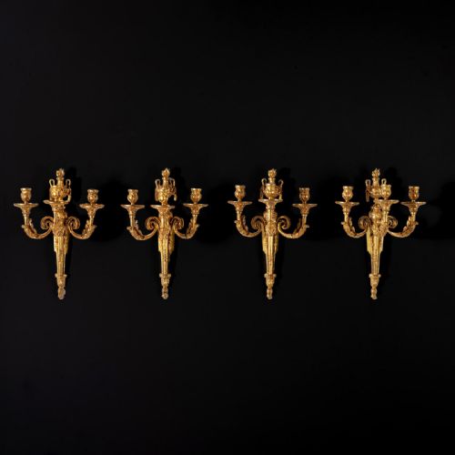 SET OF FOUR LOUIS XV ORMOLU THREE BRANCH WALL LIGHTS CIRCA 1770