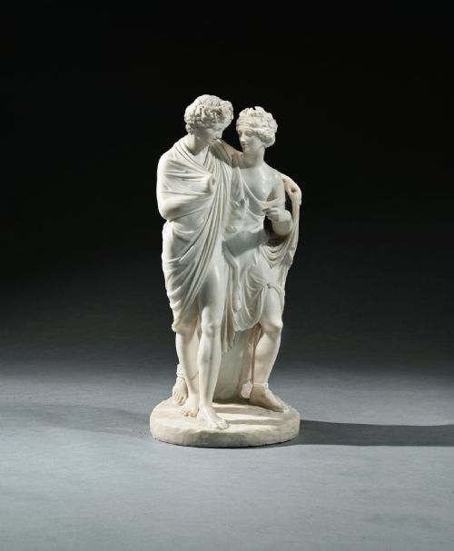 fig 1. An early 19th-century Italian carved white marble sculpture depicting the classical mythological figures of Bacchus and Ariadne standing together on an oval base.