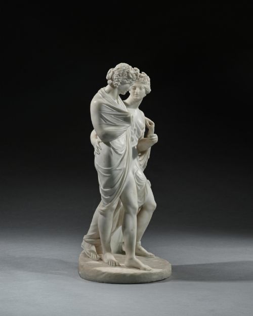 fig 2. An early 19th-century Italian carved white marble sculpture depicting the classical mythological figures of Bacchus and Ariadne standing together on an oval base.
