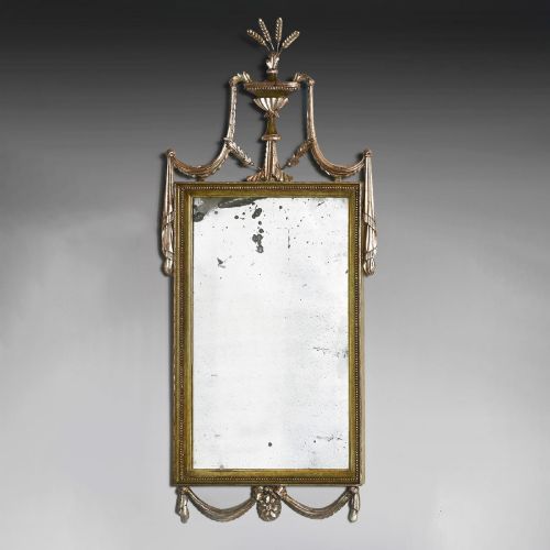 fig 4. A set of three 19th-century Neoclassical wall mirrors featuring green painted and silvered frames topped with carved urn finials and drapery swags.