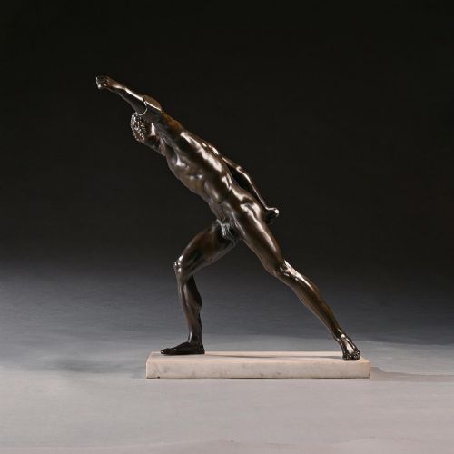fig 1. A 19th-century patinated bronze sculpture depicting the Borghese Gladiator in a dynamic lunging pose, mounted on a light-coloured marble base.
