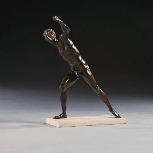 fig 2. A 19th-century patinated bronze sculpture depicting the Borghese Gladiator in a dynamic lunging pose, mounted on a light-coloured marble base.