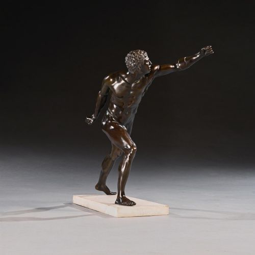 fig 3. A 19th-century patinated bronze sculpture depicting the Borghese Gladiator in a dynamic lunging pose, mounted on a light-coloured marble base.