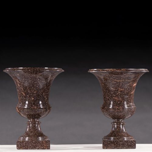 fig 1. A pair of polished dark brown speckled porphyry stone urns crafted in the classical Campana shape with flared rims and square bases.