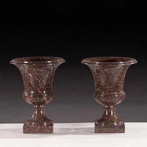 fig 2. A pair of polished dark brown speckled porphyry stone urns crafted in the classical Campana shape with flared rims and square bases.