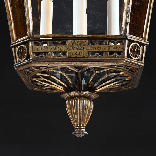 fig 2. A Regency gilt brass hall lantern featuring Gothic tracery arches, glass side panels, an upper cut-glass shade, and a hanging chain.