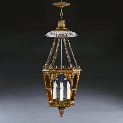 fig 5. A Regency gilt brass hall lantern featuring Gothic tracery arches, glass side panels, an upper cut-glass shade, and a hanging chain.