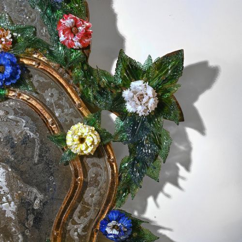 fig 4. A pair of 18th-century Venetian Murano glass wall mirrors featuring decorative glass foliage, colourful glass flowers, etched central mirror plates, and gilt accents.