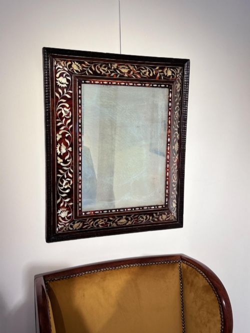 fig 4. A pair of 18th-century rectangular wall mirrors featuring rich brown tortoiseshell frames intricately inlaid with mother-of-pearl floral motifs.