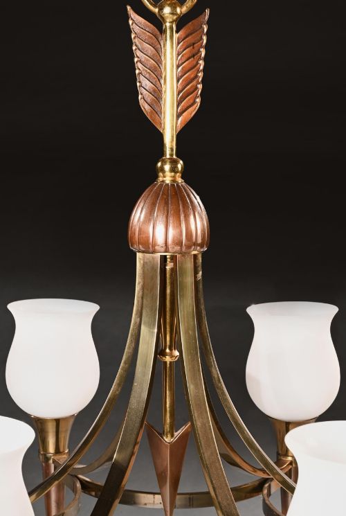 fig 1. A pair of mid-century brass chandeliers featuring six arms each, topped with tulip-shaped frosted glass shades and decorative arrow stem motifs.