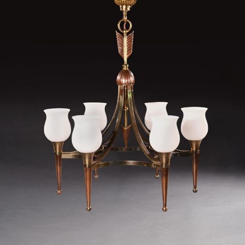 fig 2. A pair of mid-century brass chandeliers featuring six arms each, topped with tulip-shaped frosted glass shades and decorative arrow stem motifs.
