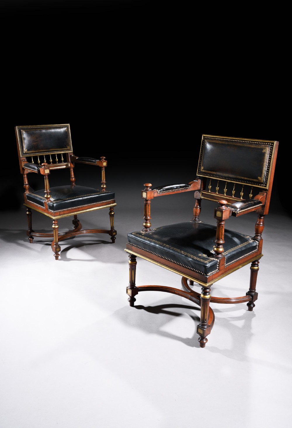 A Matched Pair of 19th Century French Brass Mounted and Leather Armchairs 