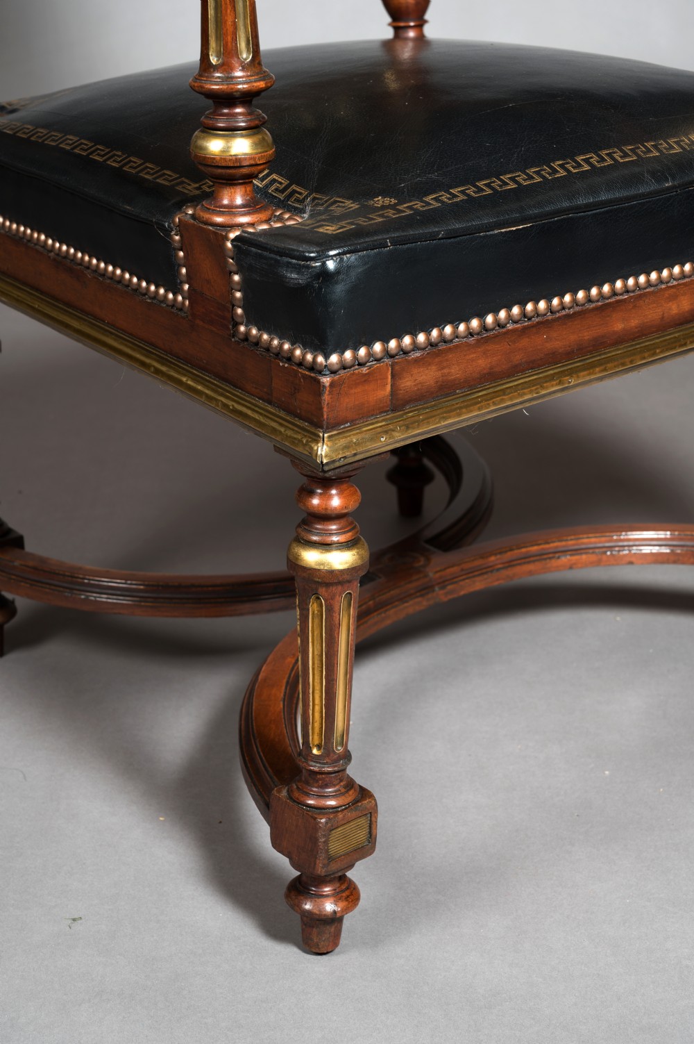 A Matched Pair of 19th Century French Brass Mounted and Leather Armchairs  View III