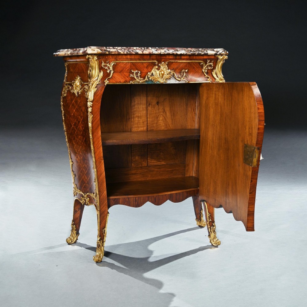 A pair of 19th-century French kingwood petit commodes featuring shaped marble tops, gilt-bronze mounts, cabriole legs, and Vernis Martin hand-painted panels depicting classical figures. View VI