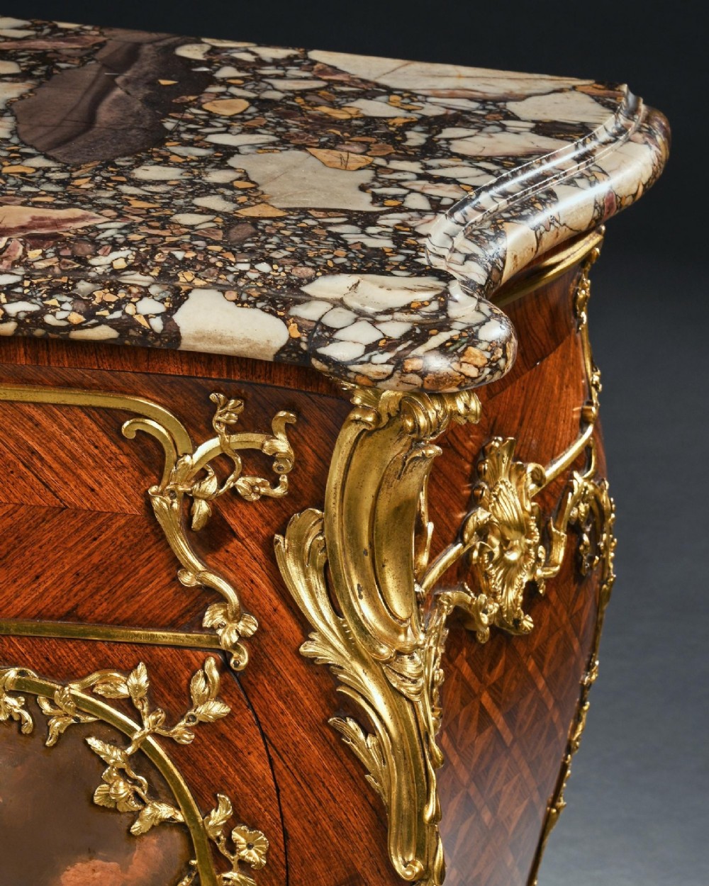 A pair of 19th-century French kingwood petit commodes featuring shaped marble tops, gilt-bronze mounts, cabriole legs, and Vernis Martin hand-painted panels depicting classical figures. View IX