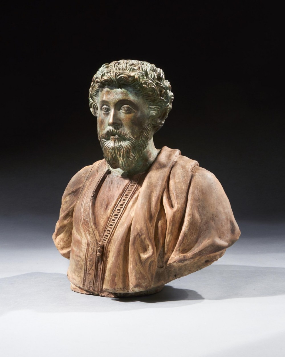 A pair of late nineteenth-century terracotta portrait busts depicting Roman Emperors Marcus Aurelius and Caracalla with verdigris-tinted heads and draped garments. View III