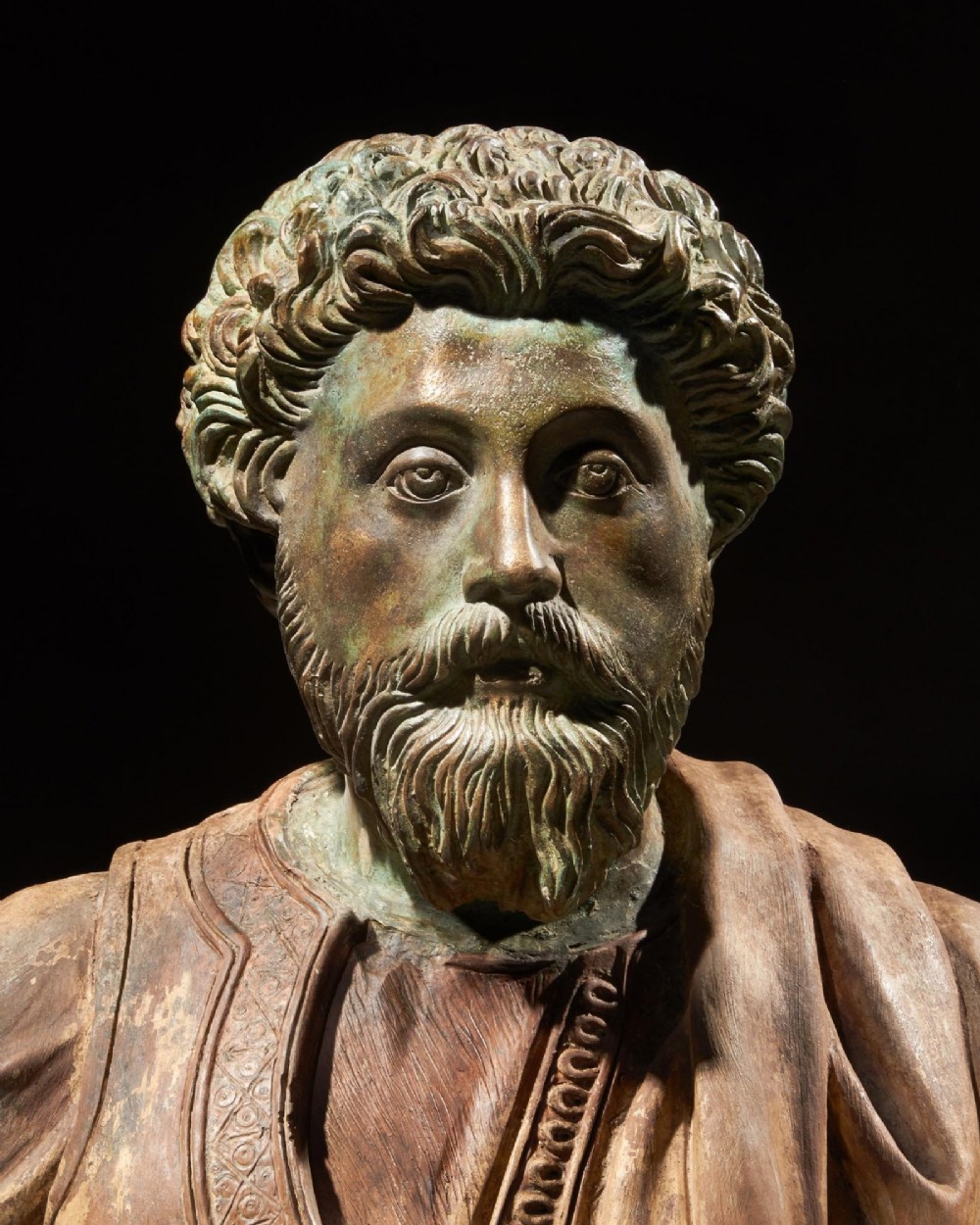 A pair of late nineteenth-century terracotta portrait busts depicting Roman Emperors Marcus Aurelius and Caracalla with verdigris-tinted heads and draped garments. View VII