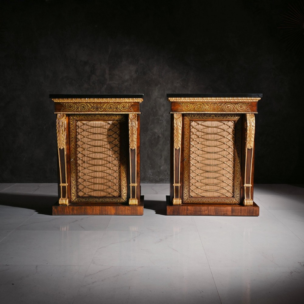 A pair of dark wood Regency side cabinets featuring intricate brass inlaid foliage, gilt corner mounts, brass wire mesh doors, and dark marble tops. View II