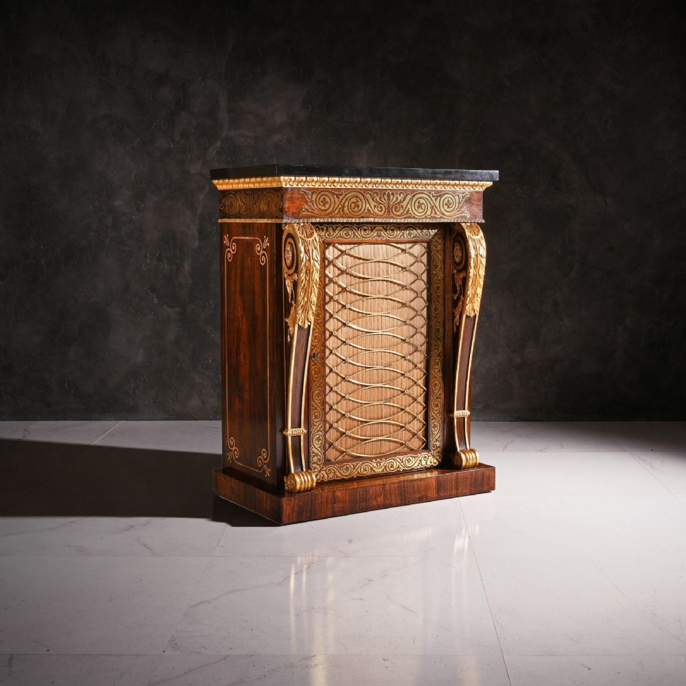 A pair of dark wood Regency side cabinets featuring intricate brass inlaid foliage, gilt corner mounts, brass wire mesh doors, and dark marble tops. View IV