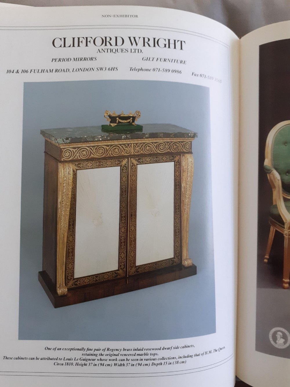 A pair of dark wood Regency side cabinets featuring intricate brass inlaid foliage, gilt corner mounts, brass wire mesh doors, and dark marble tops. View VII