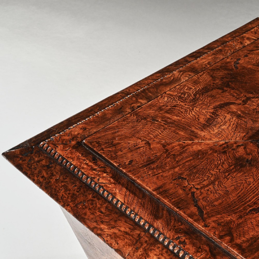 A George IV sarcophagus-shaped cellarette crafted from figured pollard oak with a stepped lid and beaded moulding on a plinth base. View VIII