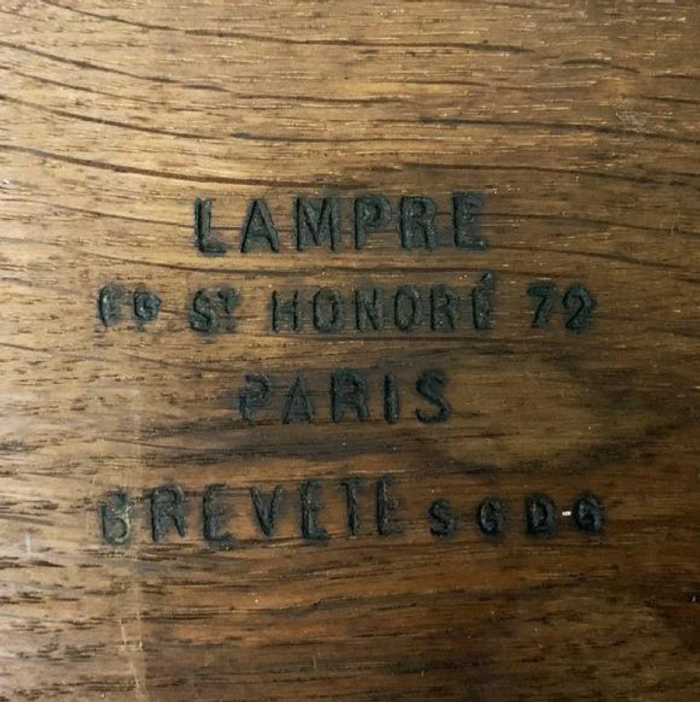 A square mahogany envelope card table with gilt bronze mounts, fluted tapered legs, and four triangular folding top flaps. View IX