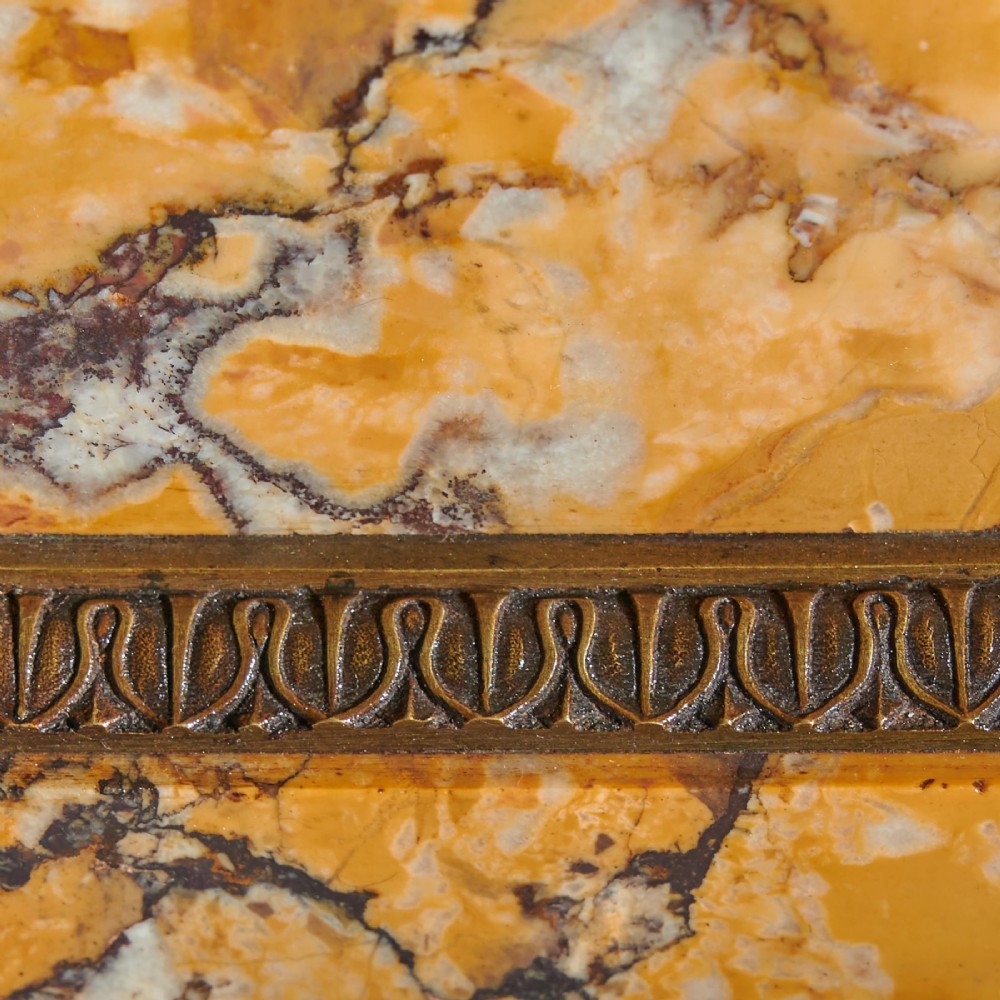 A pair of early nineteenth-century French patinated bronze tazzas with ornate scroll handles mounted on square veined yellow marble plinths. View VII