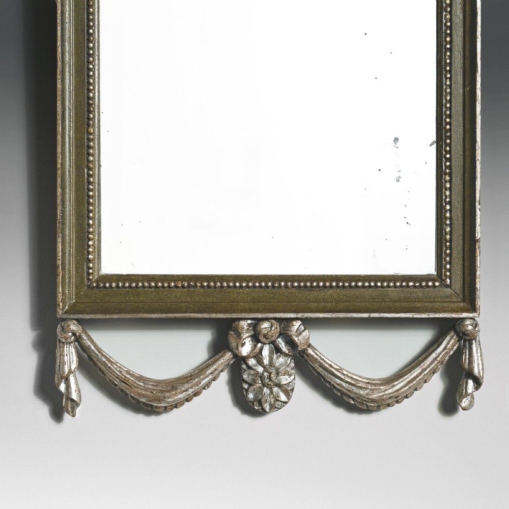 A set of three 19th-century Neoclassical wall mirrors featuring green painted and silvered frames topped with carved urn finials and drapery swags. View III
