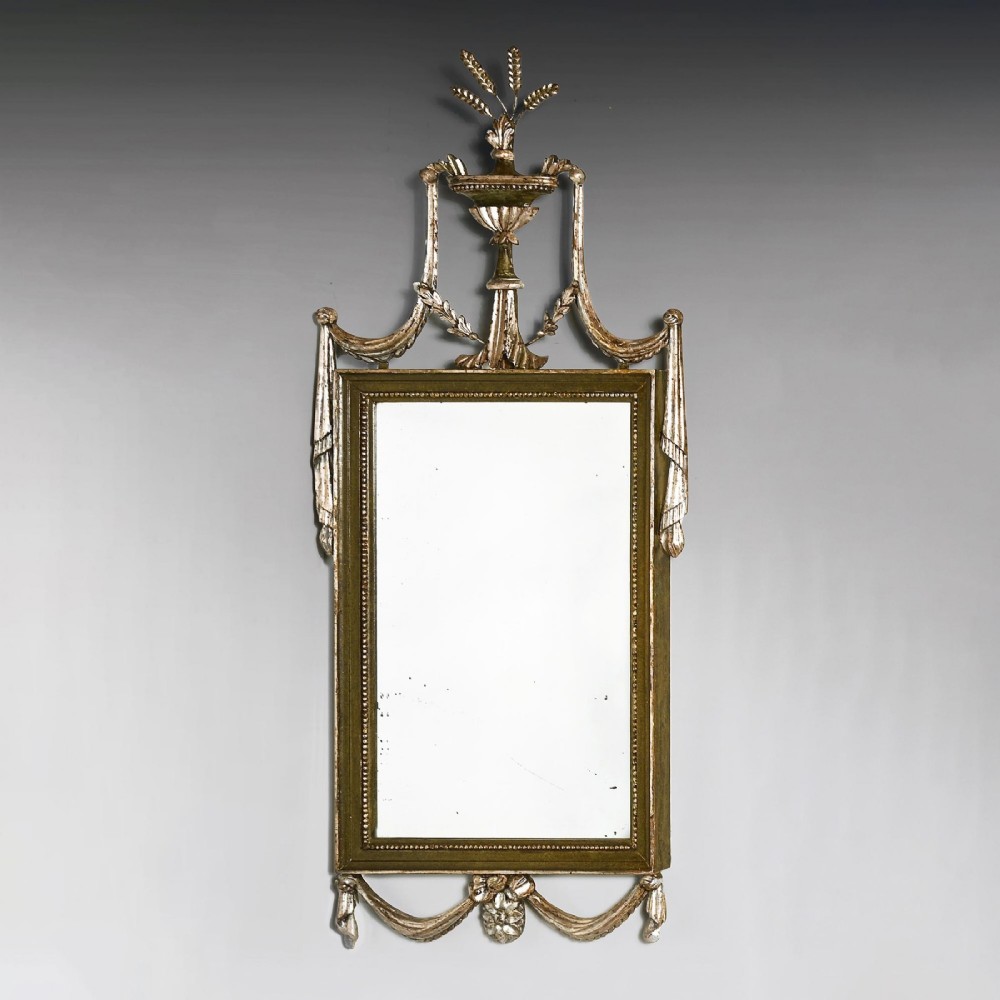 A set of three 19th-century Neoclassical wall mirrors featuring green painted and silvered frames topped with carved urn finials and drapery swags. View IV