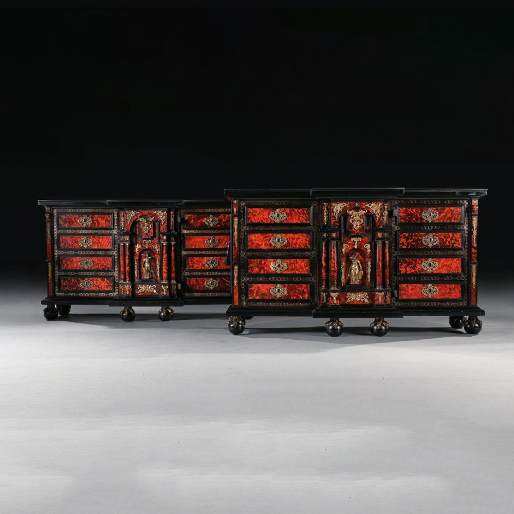 A pair of seventeenth-century Spanish Baroque ebonised and tortoiseshell cabinets featuring architectural central doors and gilt bronze mounts, elevated on tall metal stands. View V