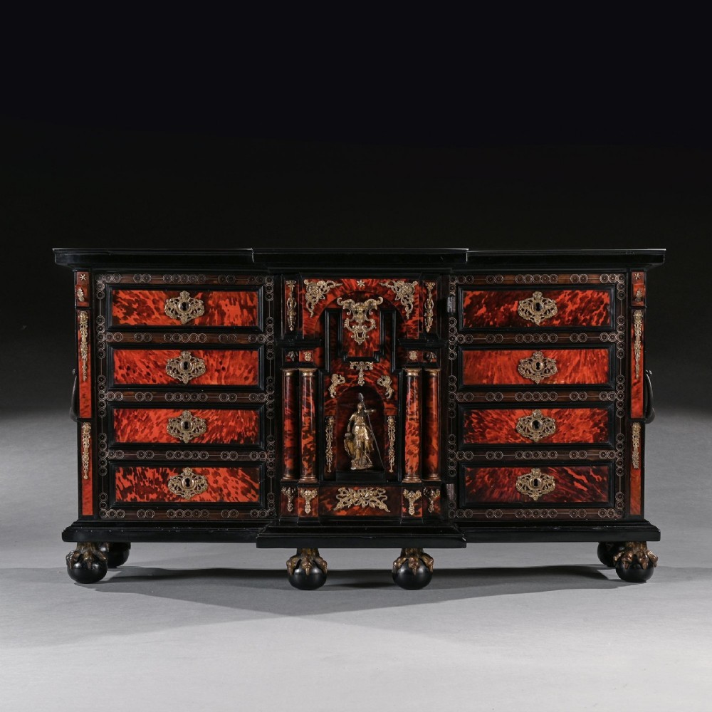 A pair of seventeenth-century Spanish Baroque ebonised and tortoiseshell cabinets featuring architectural central doors and gilt bronze mounts, elevated on tall metal stands. View VI