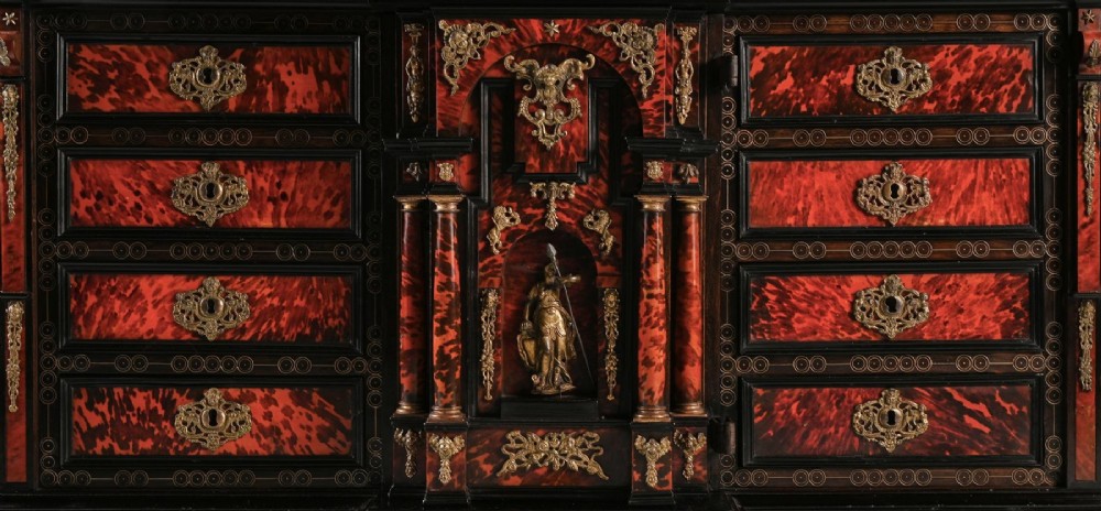 A pair of seventeenth-century Spanish Baroque ebonised and tortoiseshell cabinets featuring architectural central doors and gilt bronze mounts, elevated on tall metal stands. View VIII
