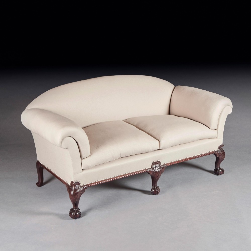 A two-seater sofa upholstered in off-white calico fabric featuring carved dark mahogany cabriole legs with ball and claw feet. View II