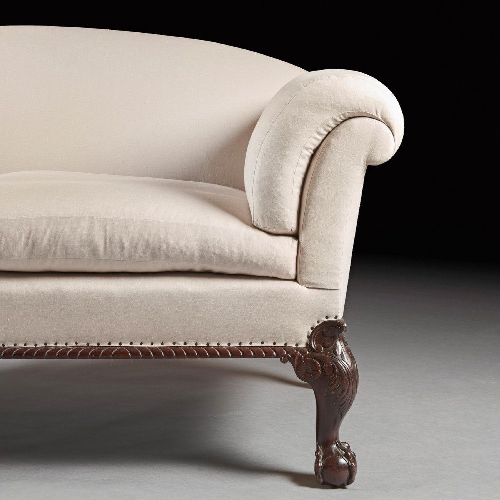 A two-seater sofa upholstered in off-white calico fabric featuring carved dark mahogany cabriole legs with ball and claw feet. View IV
