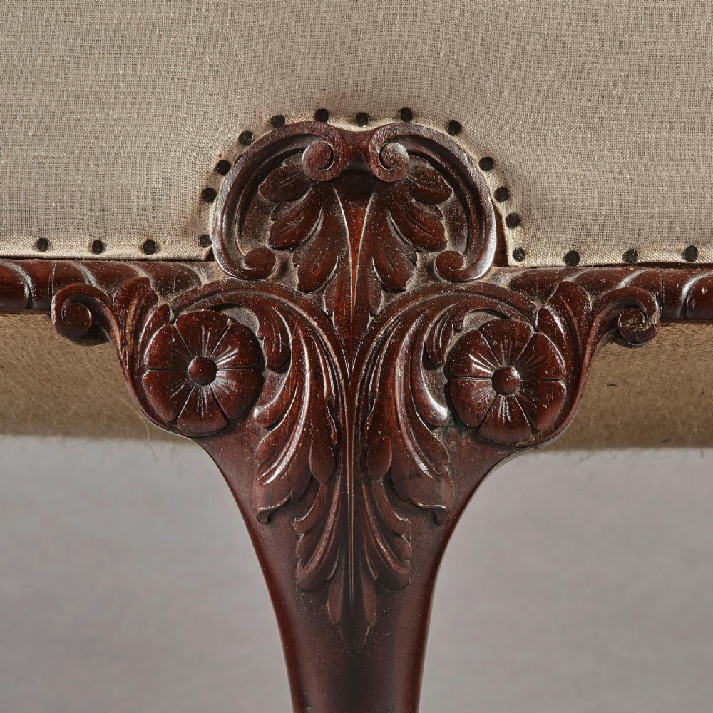 A two-seater sofa upholstered in off-white calico fabric featuring carved dark mahogany cabriole legs with ball and claw feet. View V