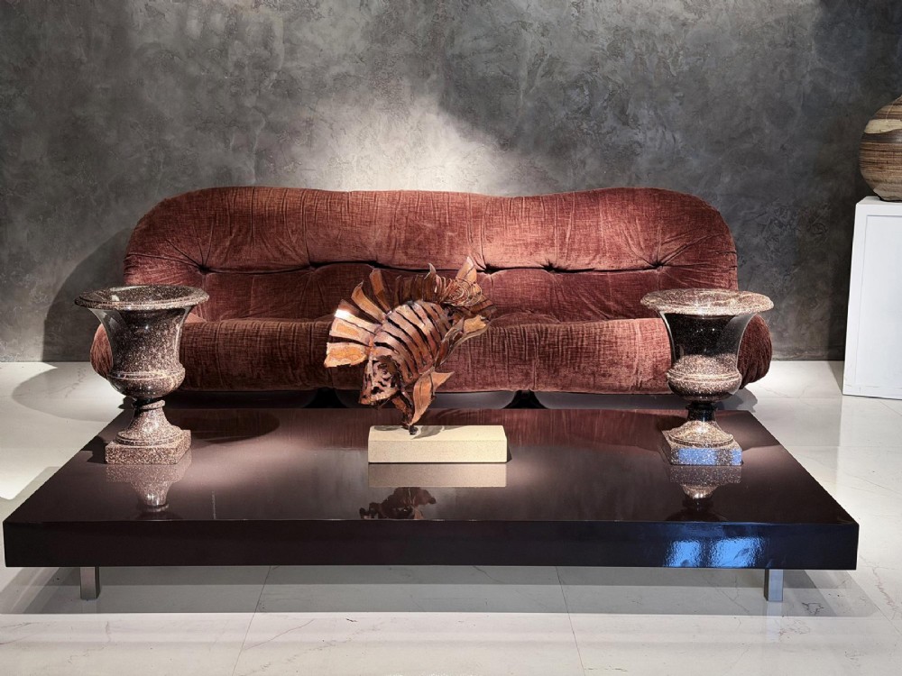 A pair of polished dark brown speckled porphyry stone urns crafted in the classical Campana shape with flared rims and square bases. View VII