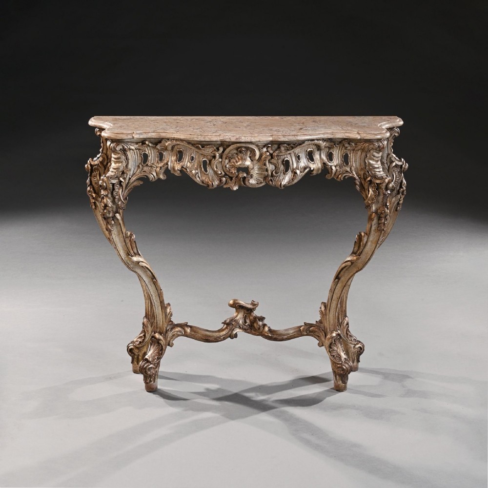 A 19th-century Italian silver gilt console table featuring elaborate Rococo carvings, cabriole legs, a central stretcher, and a contoured marble top. View III