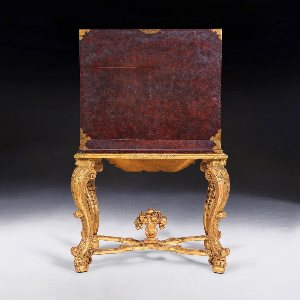 A black Japanese urushi lacquer cabinet decorated with gold landscape scenes and metal corner mounts, supported on a carved French Regence giltwood stand with cabriole legs. View VIII
