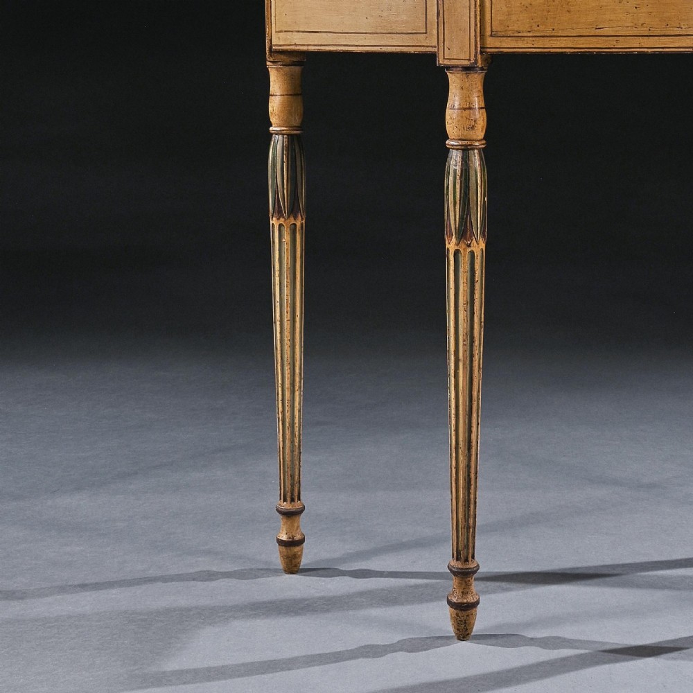 A Georgian painted demi-lune pier table featuring a semi-circular top with polychrome painted borders and four fluted tapered legs. View II