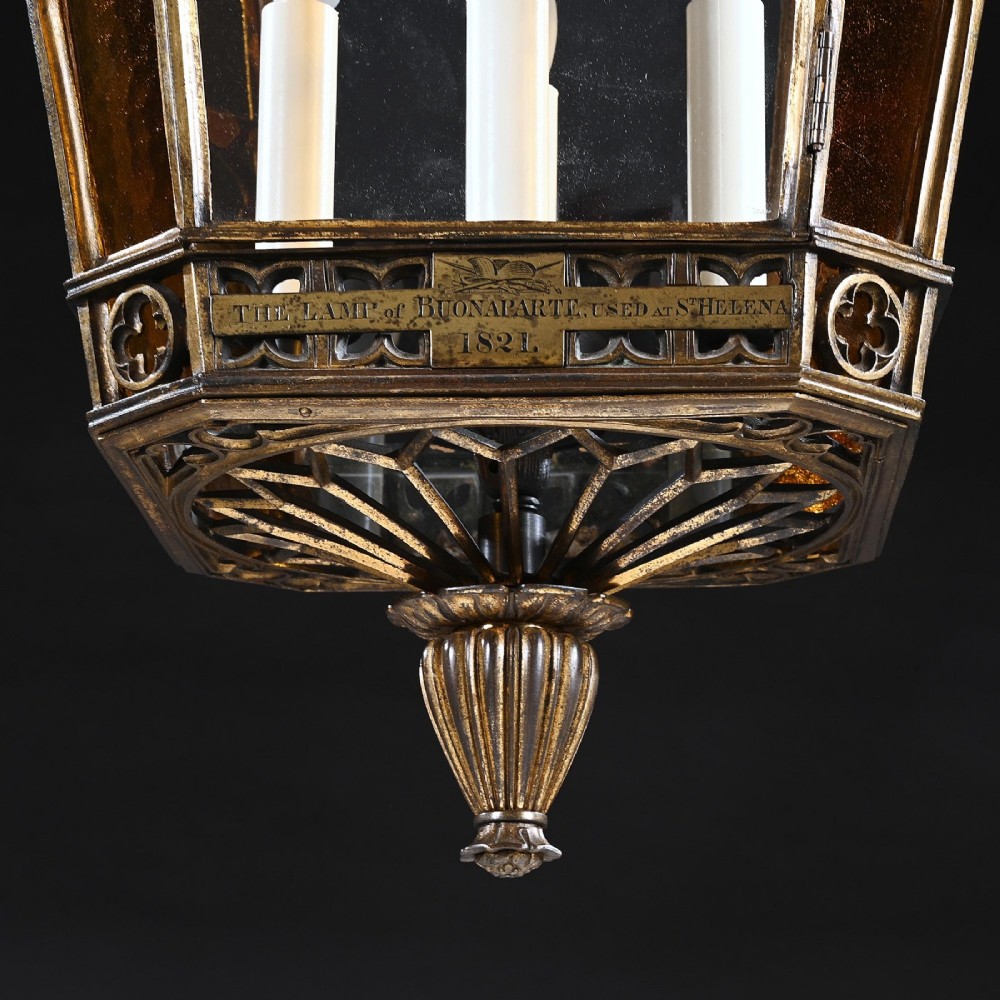 A Regency gilt brass hall lantern featuring Gothic tracery arches, glass side panels, an upper cut-glass shade, and a hanging chain. View III