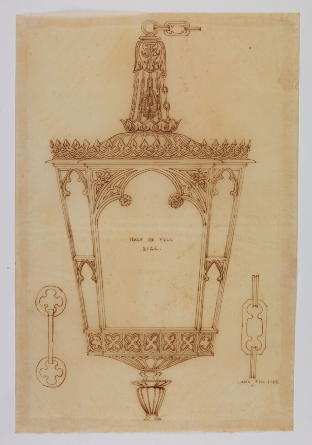 A Regency gilt brass hall lantern featuring Gothic tracery arches, glass side panels, an upper cut-glass shade, and a hanging chain. View VIII