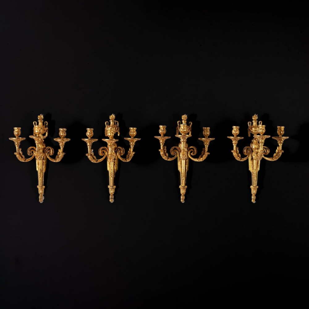 Set of Four Louis XV Ormolu Three Branch Wall Lights Circa 1770