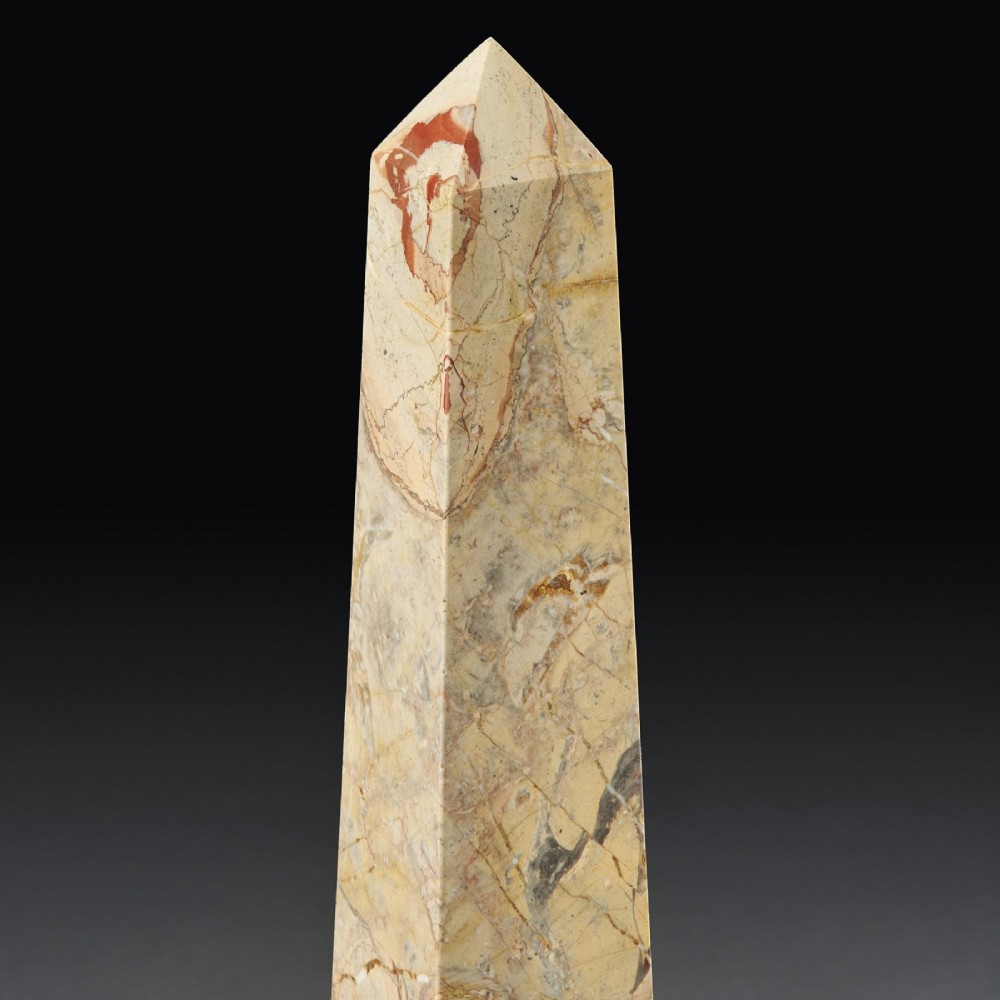 A pair of tall, veined marble obelisks carved from Portasanta and Rosso Antico marble with polished spherical details on tiered square bases. View XIII