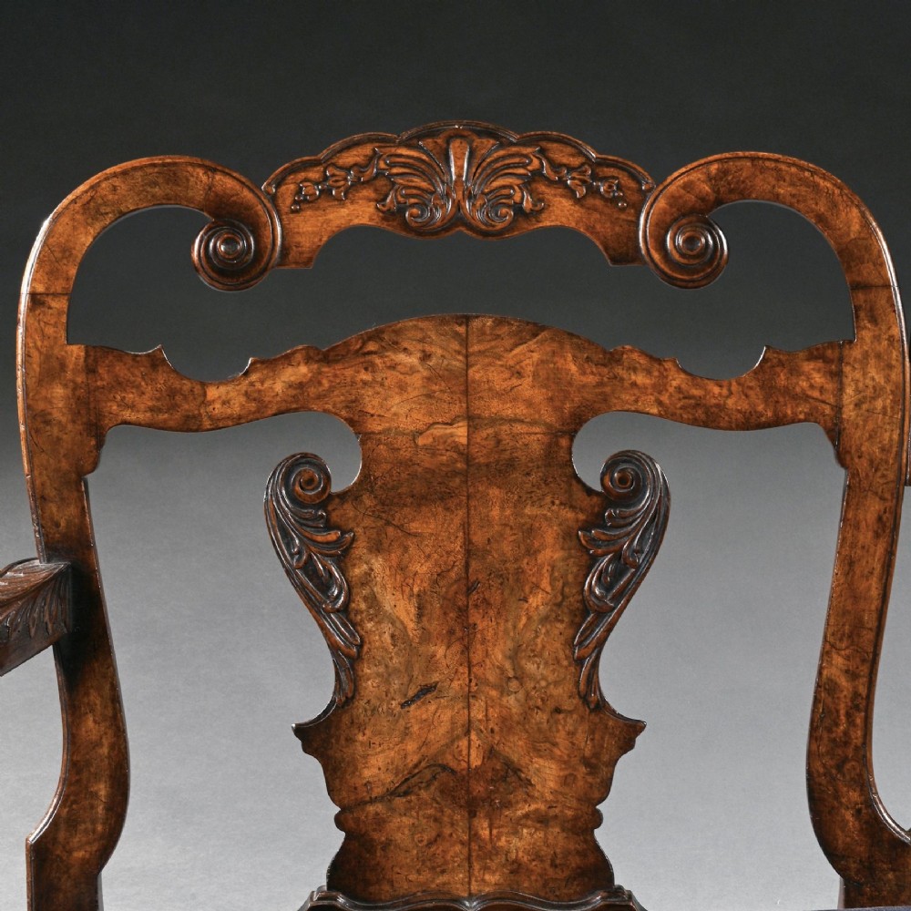 A late nineteenth-century walnut twin chair back sofa featuring vasiform splats, shell carving, cabriole legs with claw and ball feet, and a teal upholstered seat. View VI
