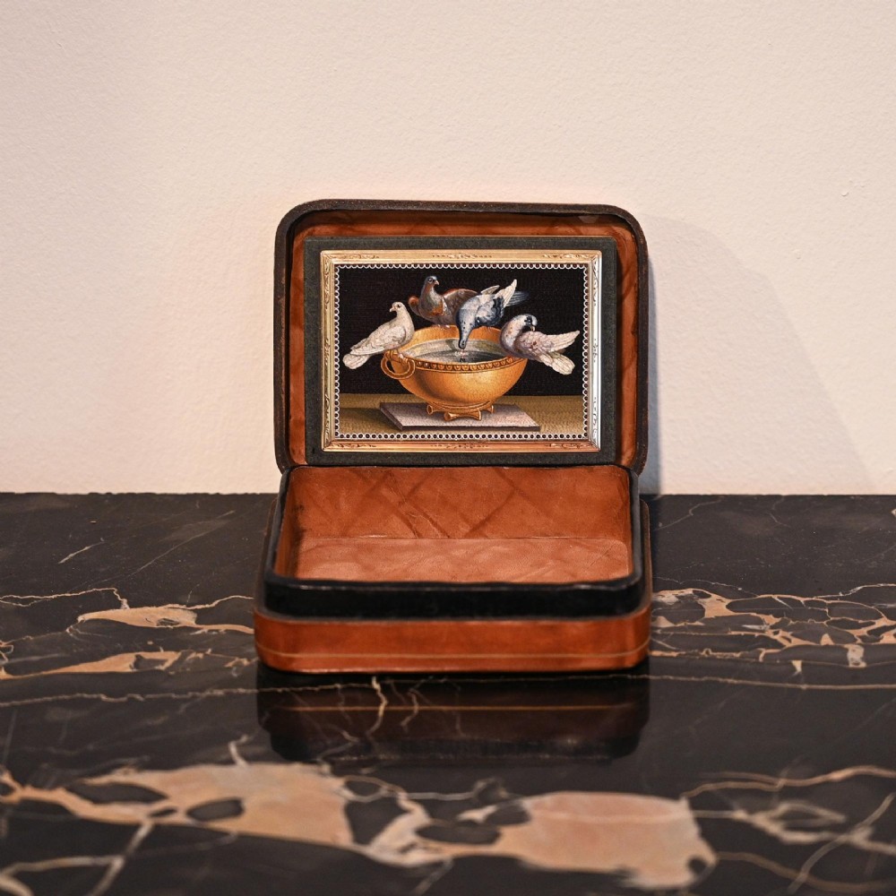 A rectangular green jasper snuff box featuring a detailed micromosaic plaque inset on the lid framed by a chase-carved gold border depicting four doves perched on a golden bowl against a dark background. View IX