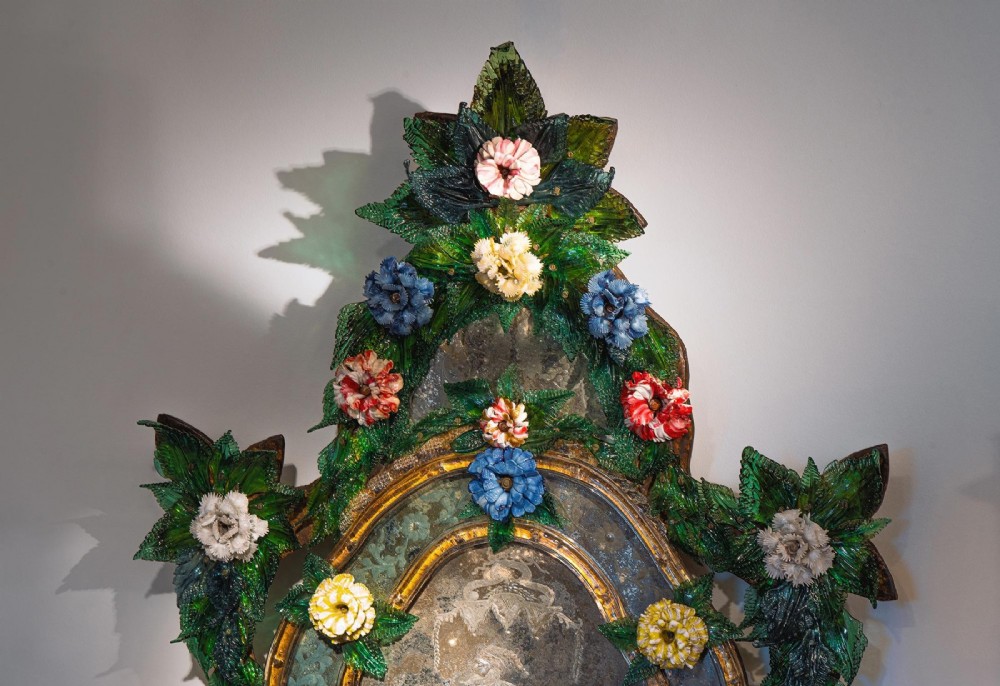 A pair of 18th-century Venetian Murano glass wall mirrors featuring decorative glass foliage, colourful glass flowers, etched central mirror plates, and gilt accents. View VII