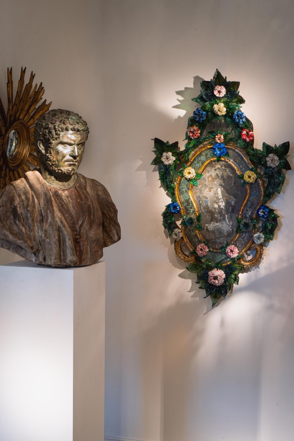 A pair of 18th-century Venetian Murano glass wall mirrors featuring decorative glass foliage, colourful glass flowers, etched central mirror plates, and gilt accents. View VIII