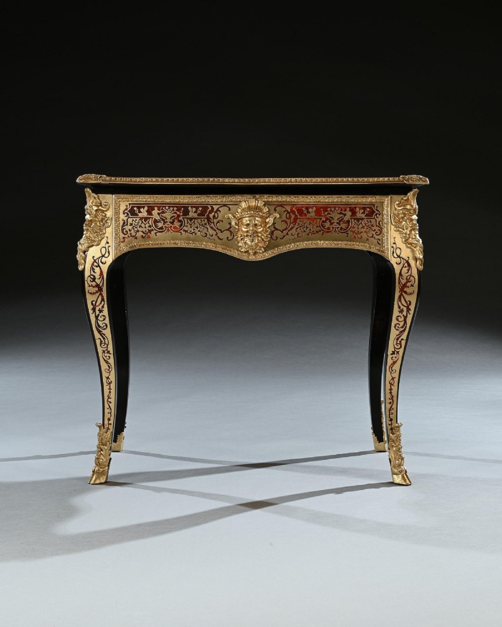 A George IV period Boulle marquetry games table featuring brass and tortoiseshell inlay, gilt-bronze mounts, cabriole legs, and an inlaid chessboard top. View III
